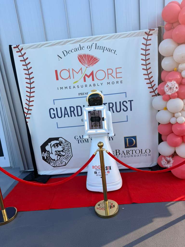 Ziggy robot on red carpet at I Am More Decade of Impact event