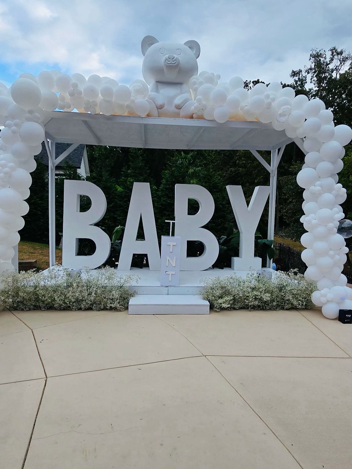 Giant white BABY letters with balloon arch and teddy bear pergola for baby shower